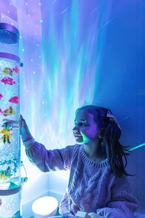 Exploring the bubble tube in the sensory room