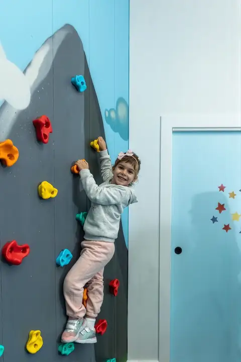 Climbing high on the rock wall
