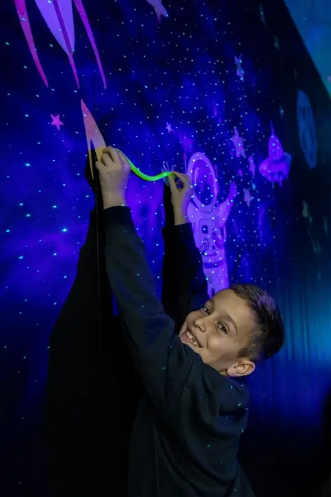 Drawing on the wall in the glow room