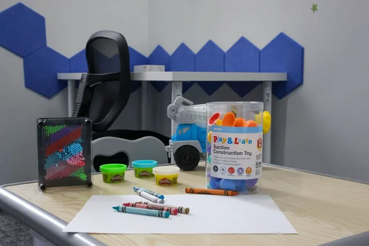 Play dough, crayons and building toys ready for a session